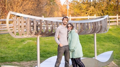 2 people in-front of an art installation