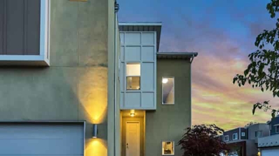 front of a modern home with outdoor lighting