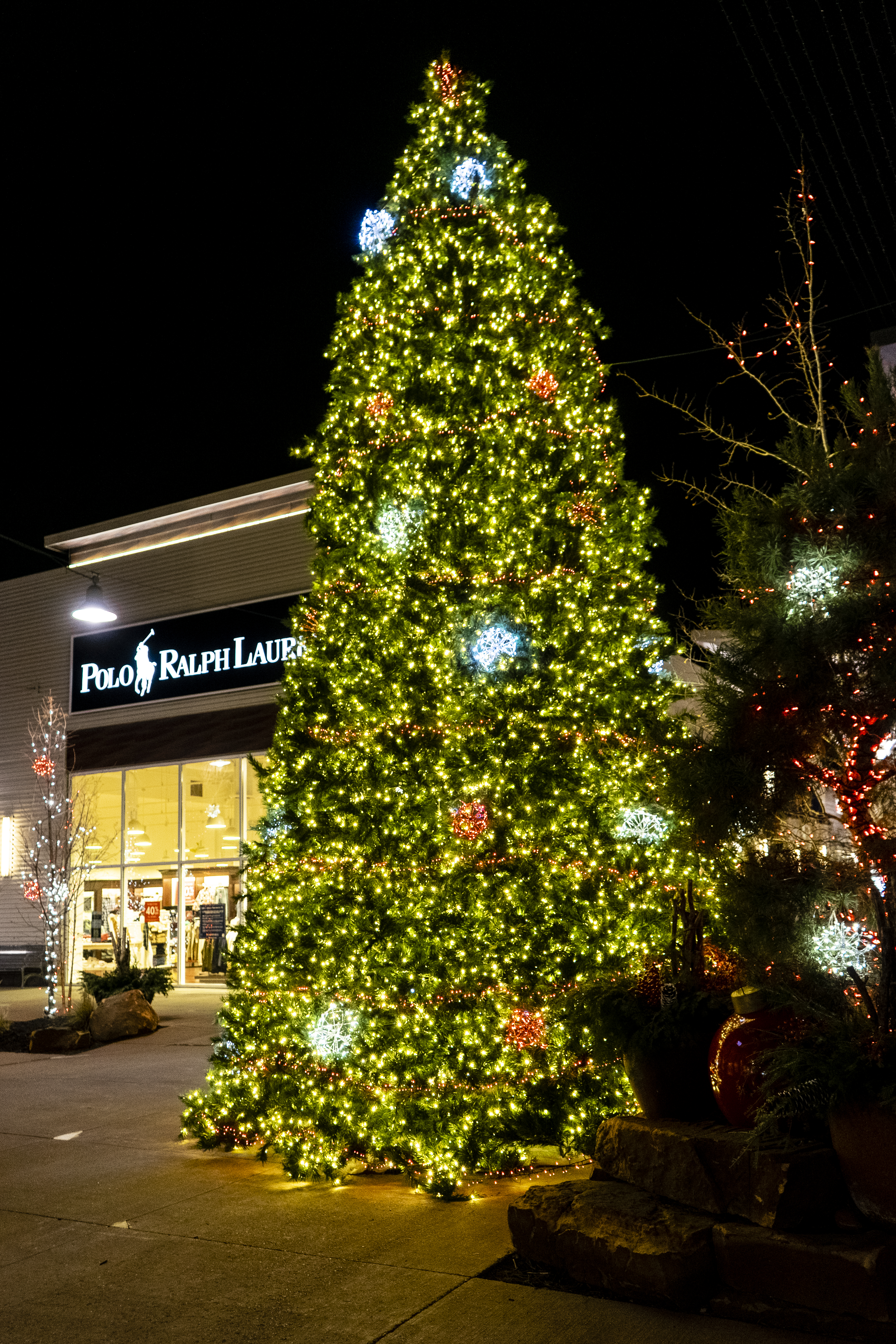 Fake Christmas tree in outdoor mall filled with lights