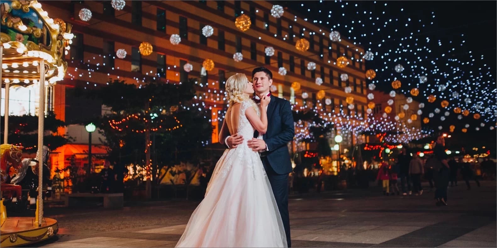 string lights over wedding couple