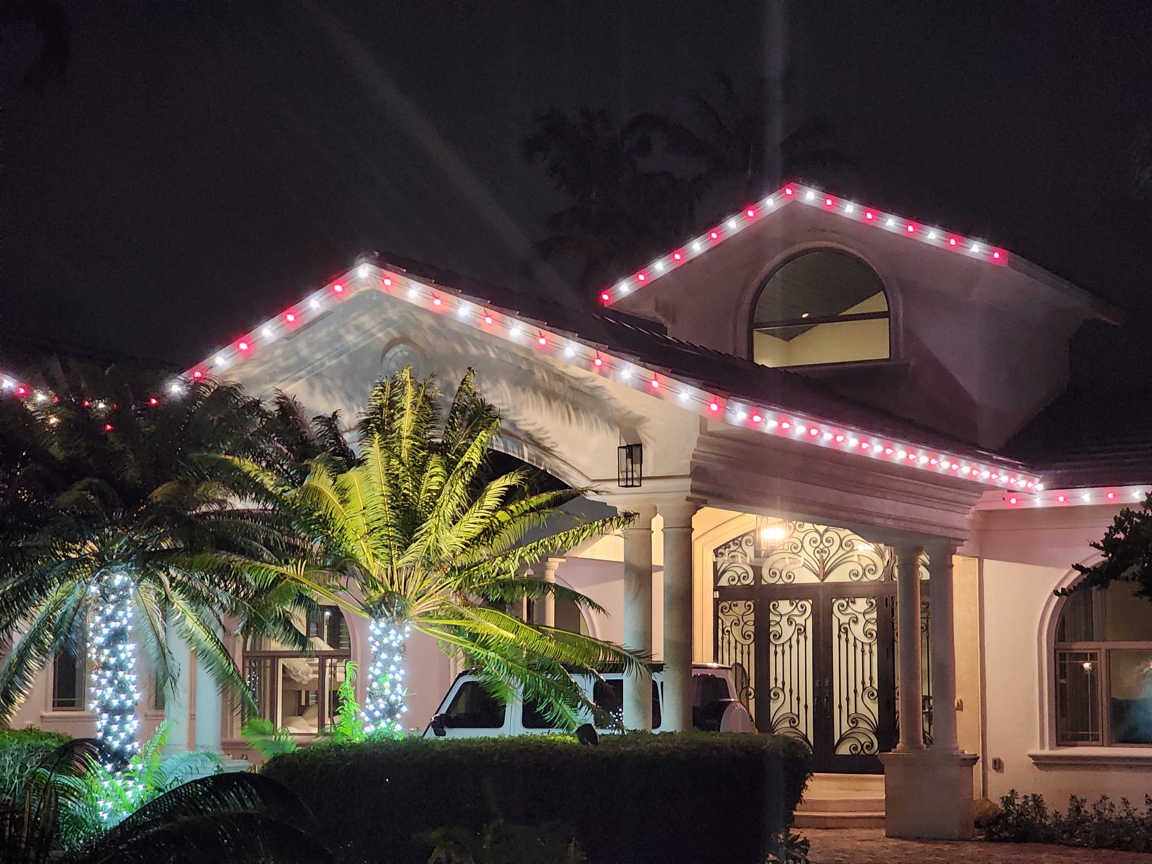 a house with red and white Christmas lights