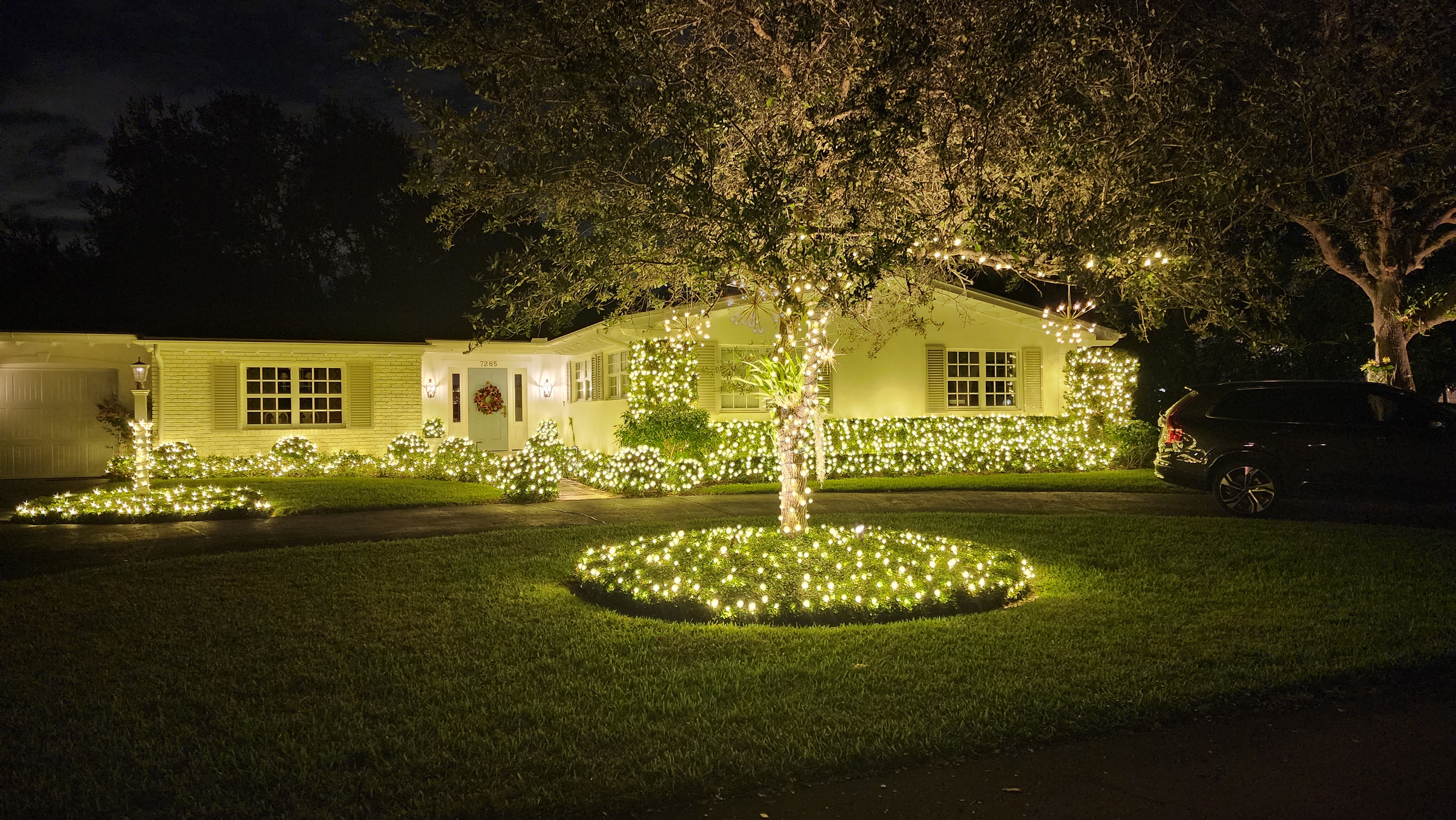 The front of a house with white Christmas lights