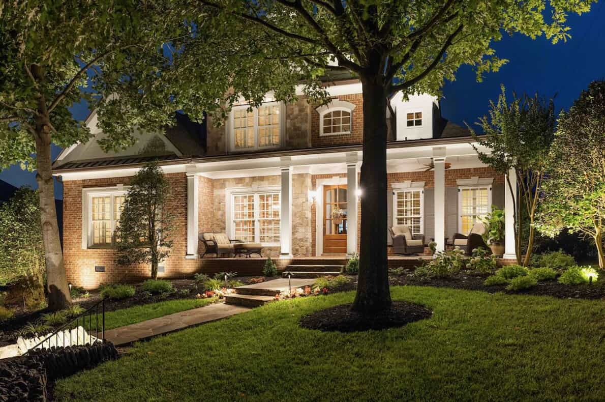 landscape lighting on house and trees