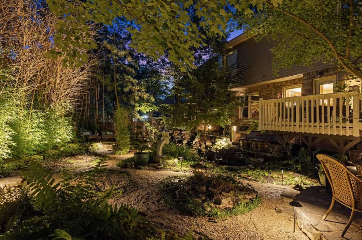 landscape lighting on house in the backyard path