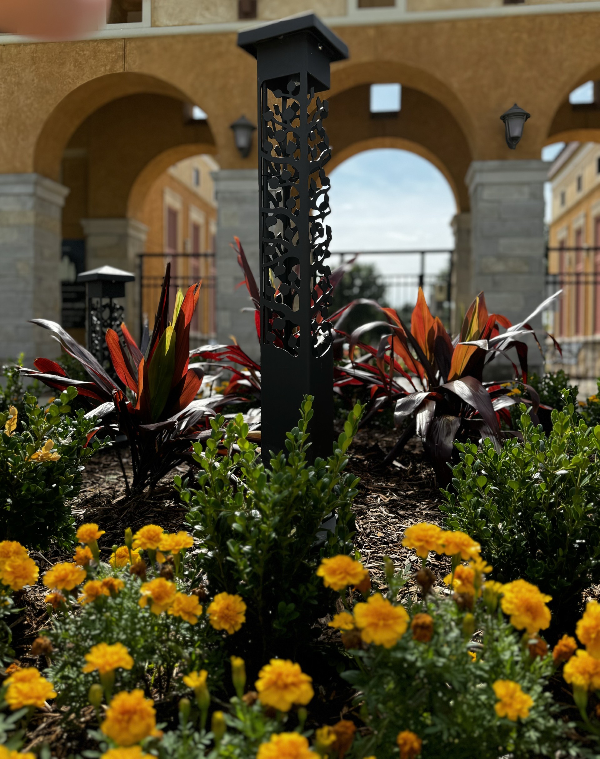 Hand-crafted steel bollards in an ivy-inspired design, beautiful by day and night.