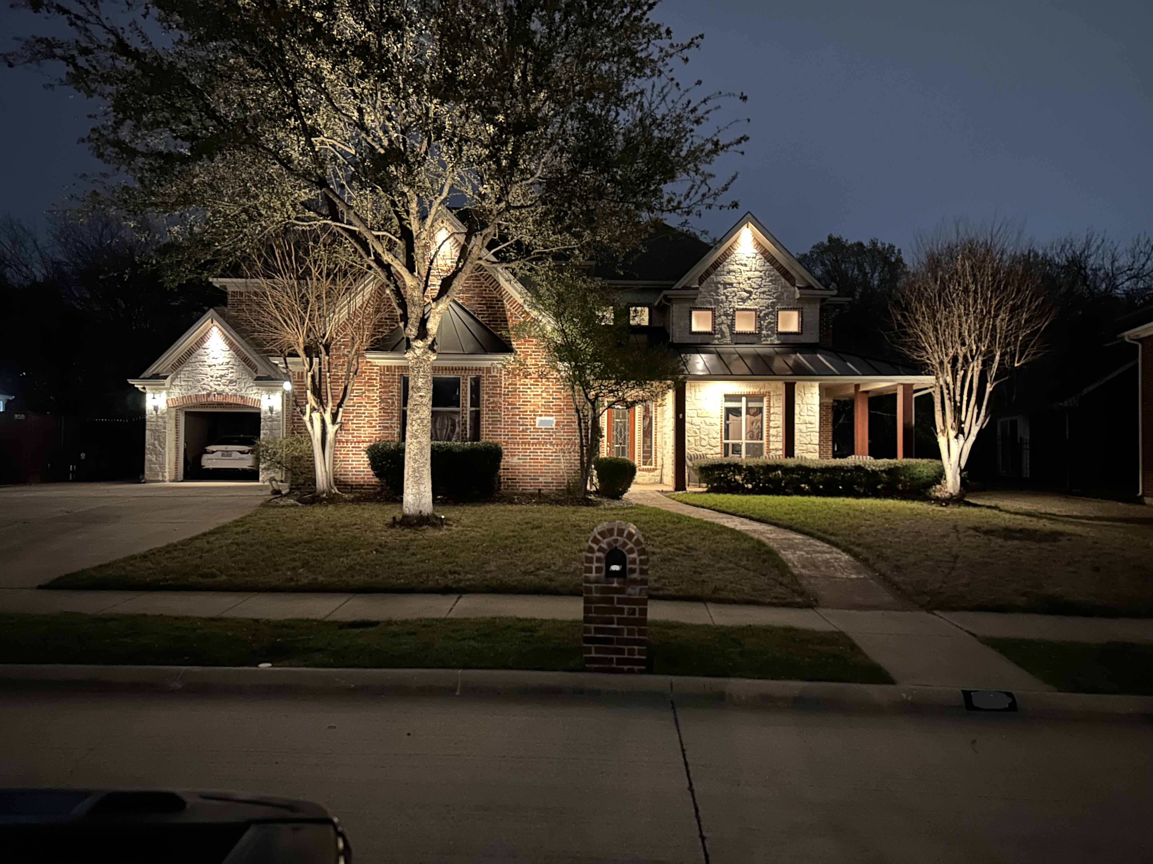 exterior of a home with outdoor lighting